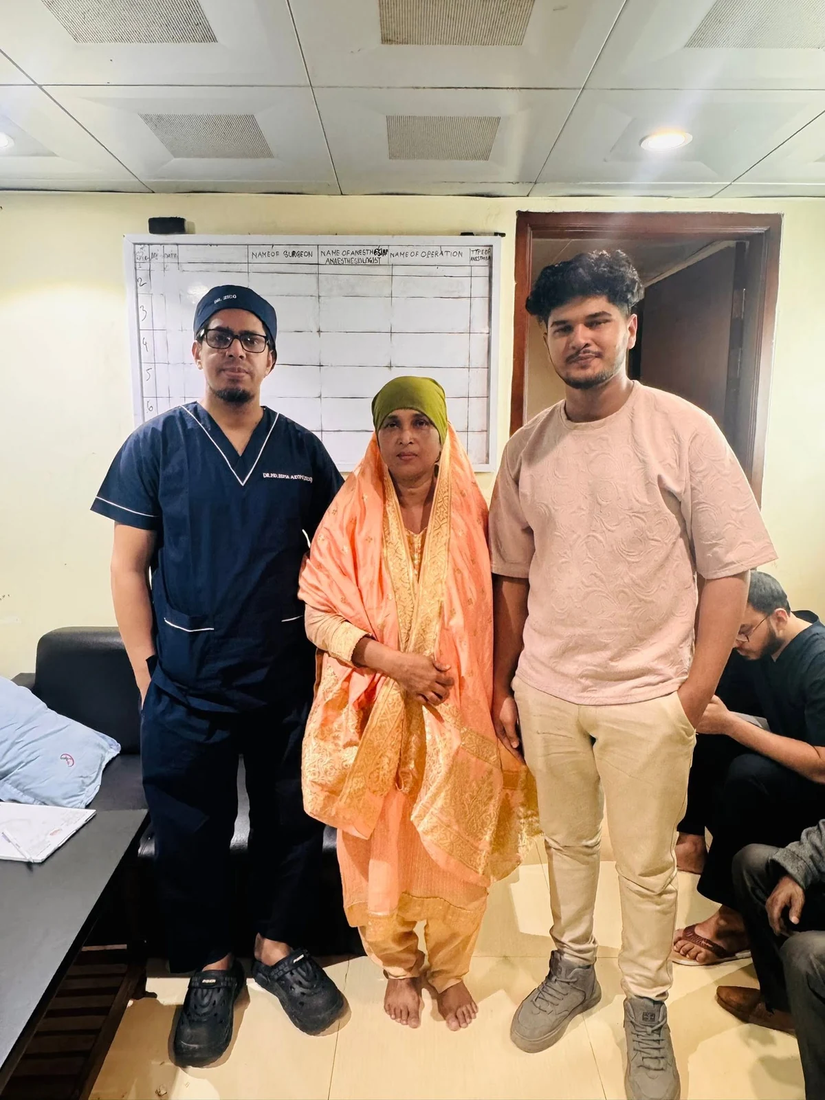 Dr. Zico with a woman patient and her family member at the clinic