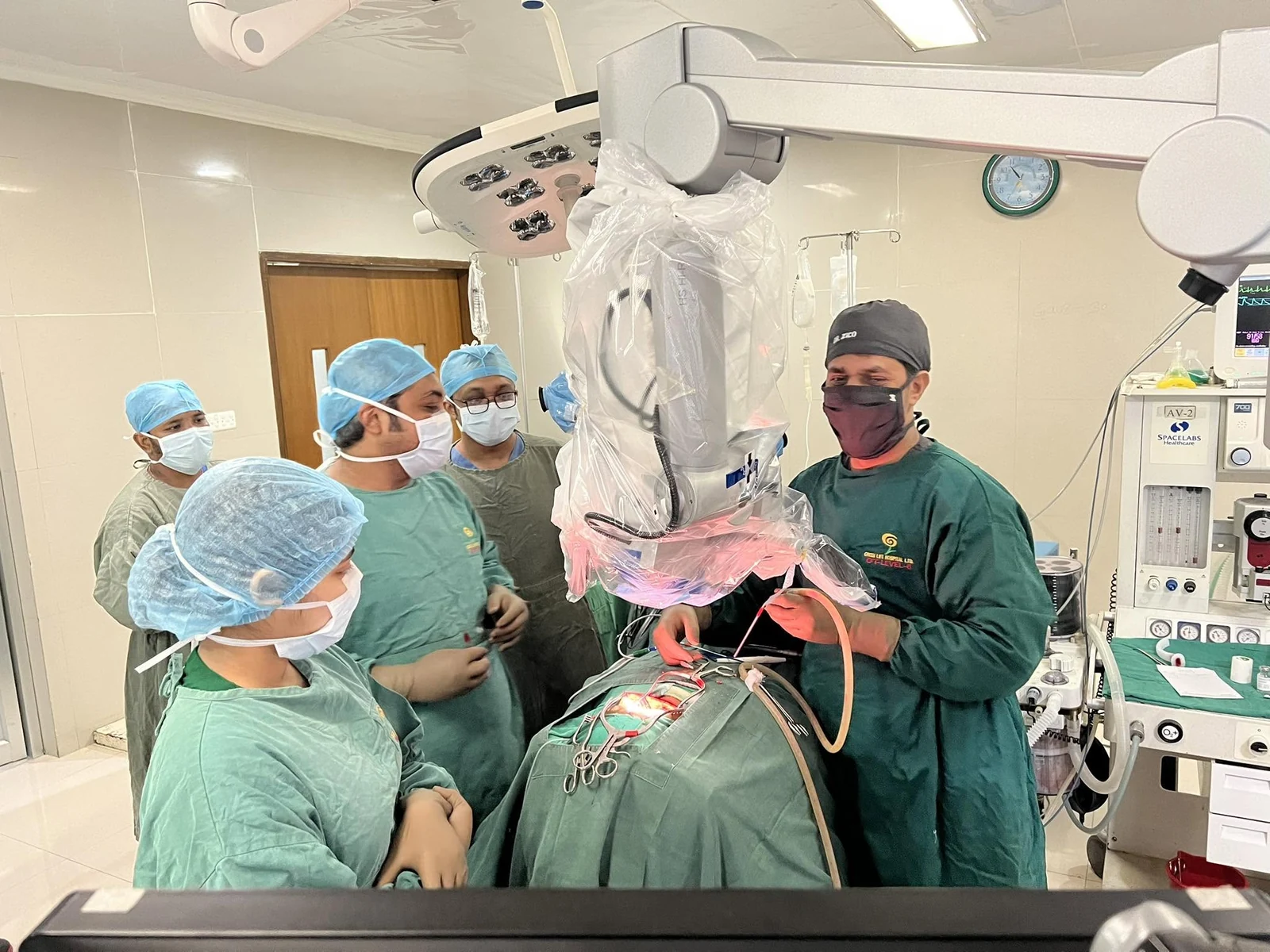 Dr. Zico and the team using the operating microscope during surgery