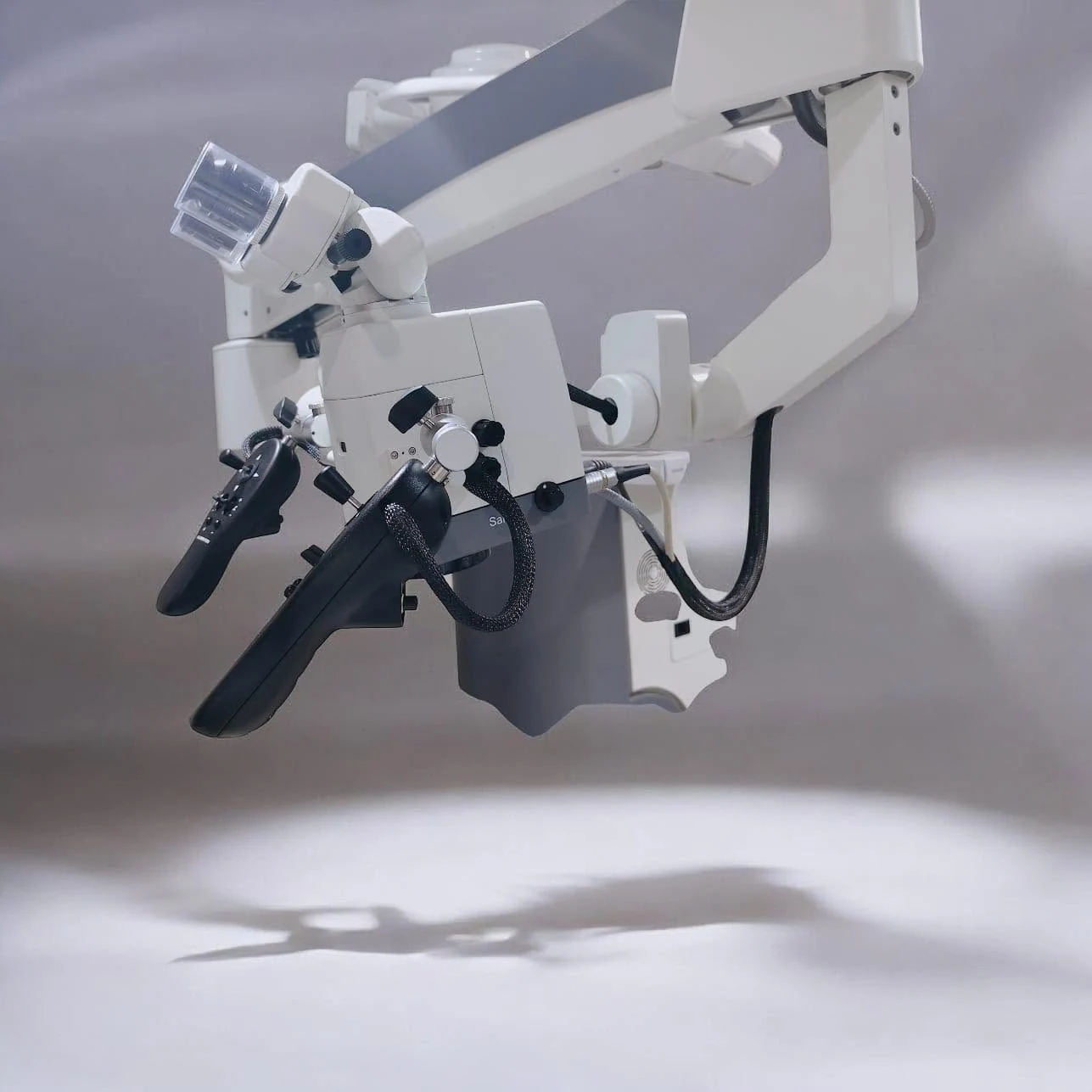 Close-up of the operating microscope optics and controls